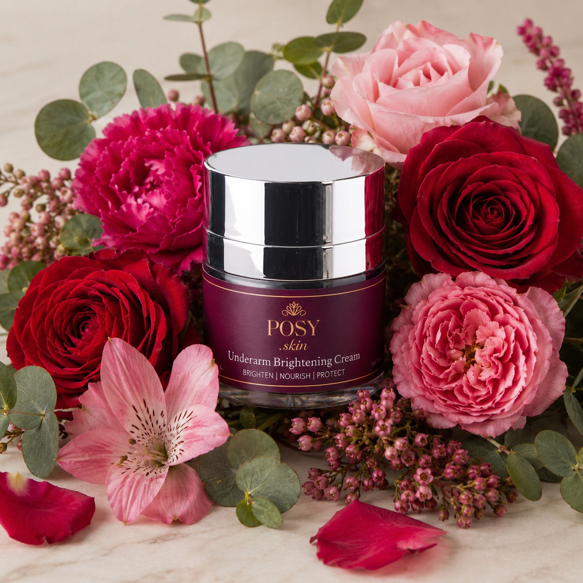 POSY skincare cream jar surrounded by red and pink flowers on a light background